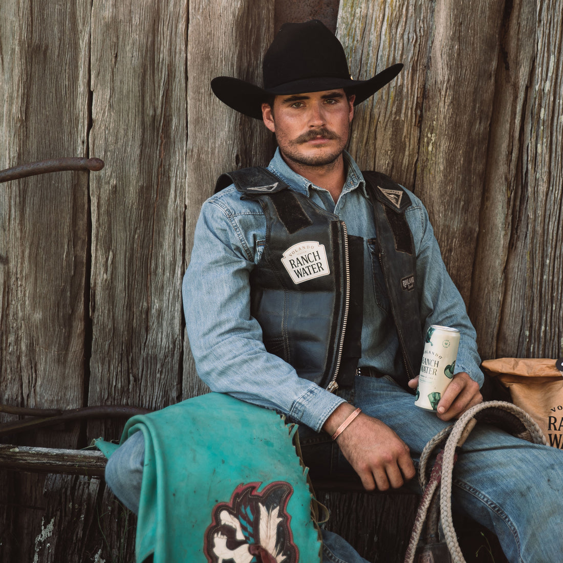 Rancher holding a can of Volando Ranch Water